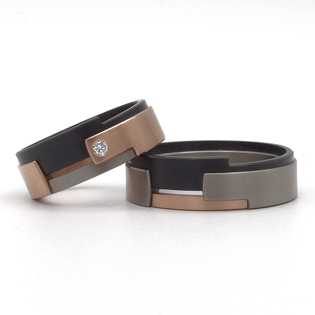 Aquila 2 Combi trouwringen van titanium, zirkonium en roodgoud 14kr met moderne vormgeving.