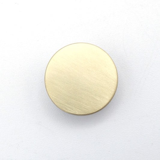 Wisselhartje met bovenvlak van 18 karaat geelgoud, verwerkt in titanium.