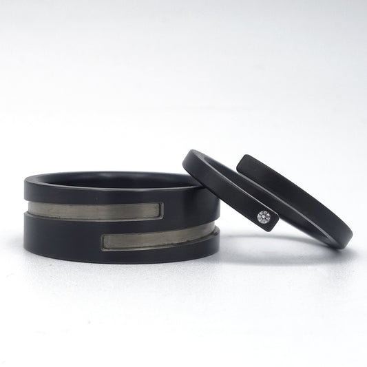 Trouwringenset Adam en Eva in zwart zirkonium met diamant