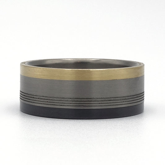 Prado ring van titanium met zirkonium en 18 karaat geelgoud.