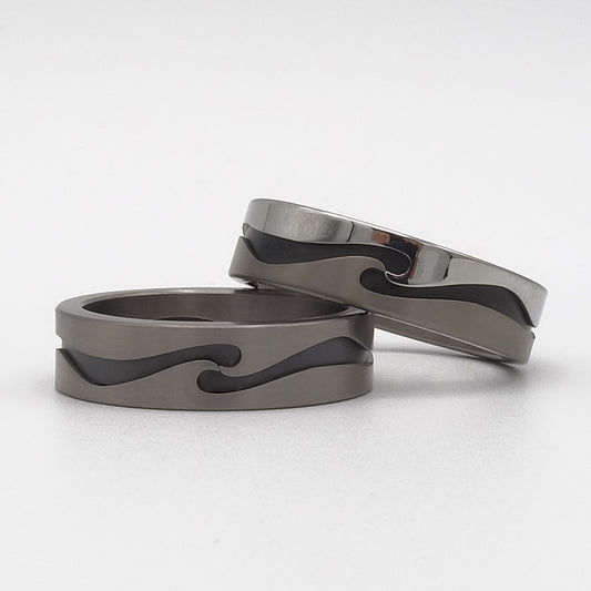 Supergolf ringen set van titanium, zirkonium en edelstaal met golvend patroon.